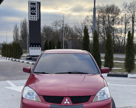 Красный Мицубиси Лансер, объемом двигателя 1.6 л и пробегом 276 тыс. км за 4550 $, фото 1 на Automoto.ua