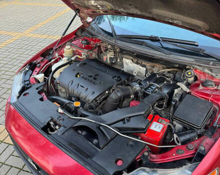 Красный Мицубиси Лансер, объемом двигателя 2 л и пробегом 143 тыс. км за 5200 $, фото 13 на Automoto.ua