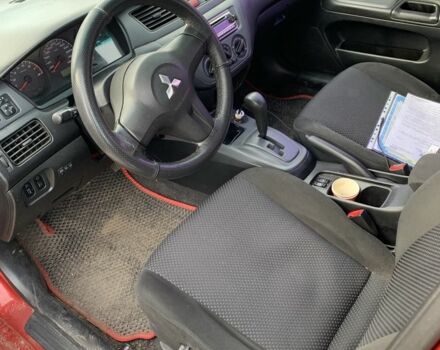 Красный Мицубиси Лансер, объемом двигателя 1.6 л и пробегом 230 тыс. км за 3000 $, фото 2 на Automoto.ua