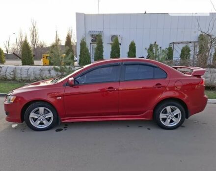 Червоний Міцубісі Lancer, об'ємом двигуна 2 л та пробігом 223 тис. км за 6950 $, фото 2 на Automoto.ua