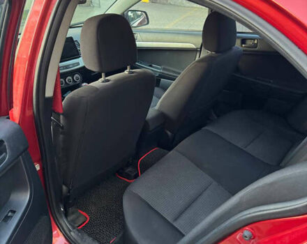 Красный Мицубиси Лансер, объемом двигателя 2 л и пробегом 143 тыс. км за 5200 $, фото 16 на Automoto.ua