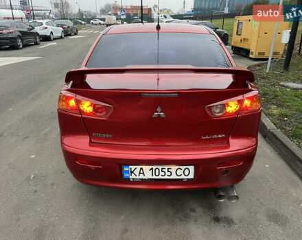 Красный Мицубиси Лансер, объемом двигателя 2 л и пробегом 330 тыс. км за 5250 $, фото 19 на Automoto.ua