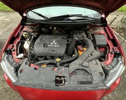 Красный Мицубиси Лансер, объемом двигателя 2 л и пробегом 366 тыс. км за 6500 $, фото 12 на Automoto.ua