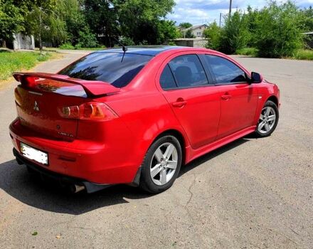 Красный Мицубиси Лансер, объемом двигателя 2 л и пробегом 300 тыс. км за 6200 $, фото 3 на Automoto.ua