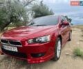 Червоний Міцубісі Lancer, об'ємом двигуна 2 л та пробігом 149 тис. км за 7100 $, фото 1 на Automoto.ua
