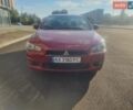 Красный Мицубиси Лансер, объемом двигателя 2 л и пробегом 307 тыс. км за 6400 $, фото 1 на Automoto.ua