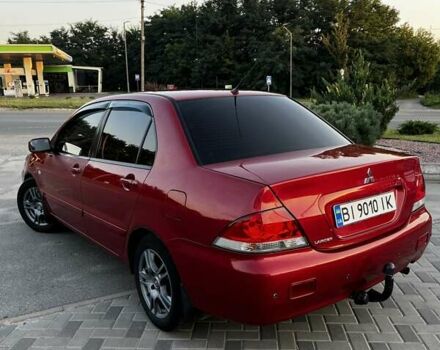 Червоний Міцубісі Lancer, об'ємом двигуна 1.6 л та пробігом 257 тис. км за 4600 $, фото 1 на Automoto.ua