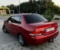Червоний Міцубісі Lancer, об'ємом двигуна 1.6 л та пробігом 257 тис. км за 4600 $, фото 1 на Automoto.ua