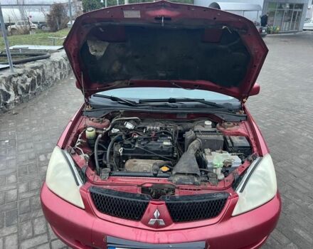 Красный Мицубиси Лансер, объемом двигателя 1.6 л и пробегом 265 тыс. км за 2956 $, фото 7 на Automoto.ua