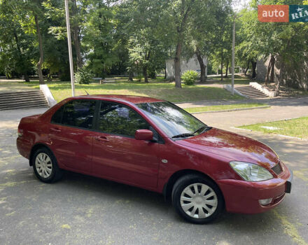 Червоний Міцубісі Lancer, об'ємом двигуна 1.6 л та пробігом 270 тис. км за 5699 $, фото 5 на Automoto.ua