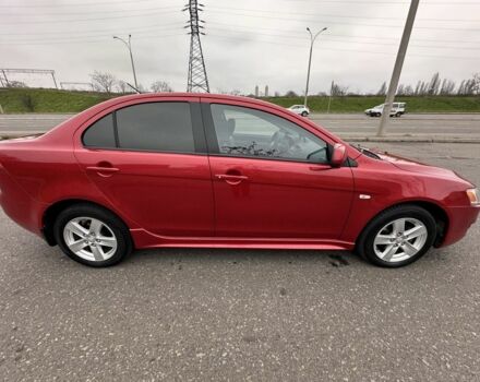 Красный Мицубиси Лансер, объемом двигателя 2 л и пробегом 366 тыс. км за 6500 $, фото 3 на Automoto.ua