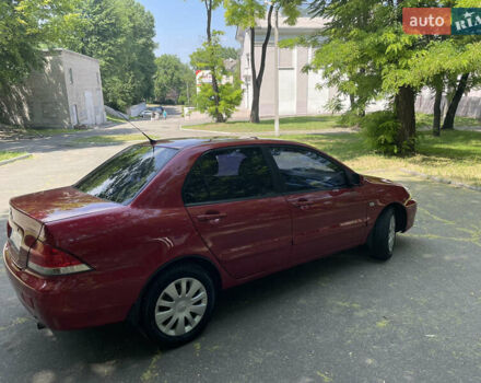 Червоний Міцубісі Lancer, об'ємом двигуна 1.6 л та пробігом 270 тис. км за 5699 $, фото 6 на Automoto.ua