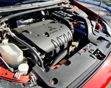 Красный Мицубиси Лансер, объемом двигателя 2 л и пробегом 110 тыс. км за 7500 $, фото 9 на Automoto.ua