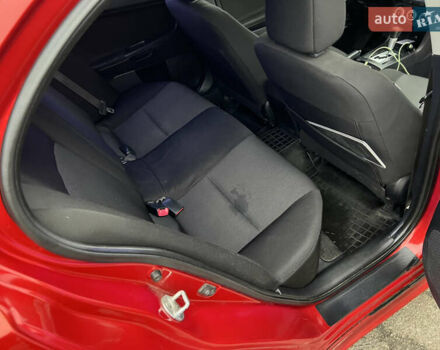 Красный Мицубиси Лансер, объемом двигателя 2 л и пробегом 330 тыс. км за 5250 $, фото 7 на Automoto.ua