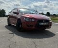 Червоний Міцубісі Lancer, об'ємом двигуна 2 л та пробігом 214 тис. км за 6299 $, фото 1 на Automoto.ua