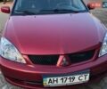 Красный Мицубиси Лансер, объемом двигателя 0 л и пробегом 82 тыс. км за 6000 $, фото 1 на Automoto.ua