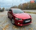 Красный Мицубиси Лансер, объемом двигателя 2 л и пробегом 197 тыс. км за 6500 $, фото 1 на Automoto.ua