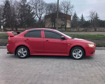 Красный Мицубиси Лансер, объемом двигателя 2 л и пробегом 200 тыс. км за 6000 $, фото 3 на Automoto.ua