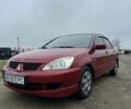 Червоний Міцубісі Lancer, об'ємом двигуна 1.6 л та пробігом 224 тис. км за 4300 $, фото 1 на Automoto.ua