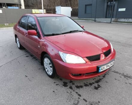 Червоний Міцубісі Lancer, об'ємом двигуна 1.6 л та пробігом 140 тис. км за 6000 $, фото 1 на Automoto.ua