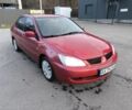 Червоний Міцубісі Lancer, об'ємом двигуна 1.6 л та пробігом 140 тис. км за 6000 $, фото 1 на Automoto.ua