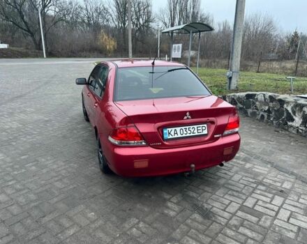 Красный Мицубиси Лансер, объемом двигателя 1.6 л и пробегом 265 тыс. км за 2956 $, фото 13 на Automoto.ua