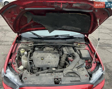 Красный Мицубиси Лансер, объемом двигателя 2 л и пробегом 330 тыс. км за 5250 $, фото 1 на Automoto.ua