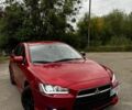 Червоний Міцубісі Lancer, об'ємом двигуна 2 л та пробігом 186 тис. км за 8000 $, фото 1 на Automoto.ua
