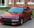 Красный Мицубиси Лансер, объемом двигателя 2 л и пробегом 280 тыс. км за 5500 $, фото 1 на Automoto.ua