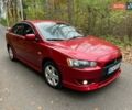 Красный Мицубиси Лансер, объемом двигателя 2 л и пробегом 197 тыс. км за 6500 $, фото 2 на Automoto.ua