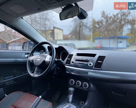 Красный Мицубиси Лансер, объемом двигателя 1.5 л и пробегом 120 тыс. км за 7699 $, фото 9 на Automoto.ua