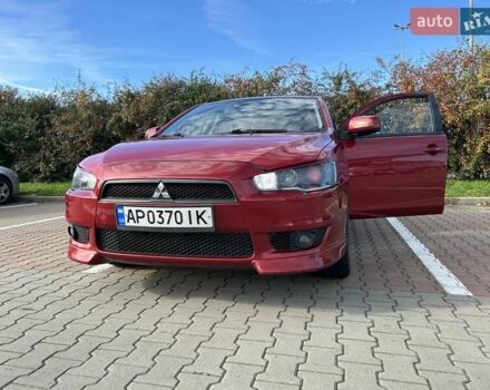 Красный Мицубиси Лансер, объемом двигателя 2 л и пробегом 227 тыс. км за 7000 $, фото 9 на Automoto.ua