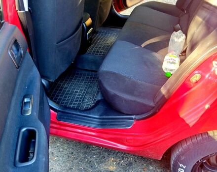 Красный Мицубиси Лансер, объемом двигателя 1.6 л и пробегом 144 тыс. км за 6000 $, фото 3 на Automoto.ua