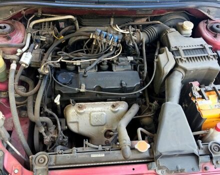 Красный Мицубиси Лансер, объемом двигателя 1.6 л и пробегом 144 тыс. км за 6000 $, фото 2 на Automoto.ua