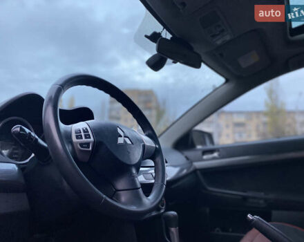 Красный Мицубиси Лансер, объемом двигателя 1.5 л и пробегом 120 тыс. км за 7699 $, фото 6 на Automoto.ua