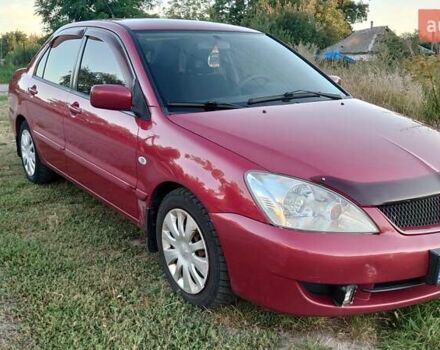 Красный Мицубиси Лансер, объемом двигателя 1.58 л и пробегом 198 тыс. км за 4650 $, фото 1 на Automoto.ua