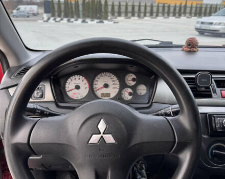 Красный Мицубиси Лансер, объемом двигателя 1.6 л и пробегом 276 тыс. км за 4550 $, фото 8 на Automoto.ua