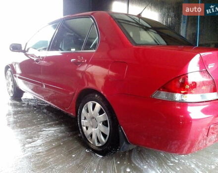 Червоний Міцубісі Lancer, об'ємом двигуна 1.6 л та пробігом 242 тис. км за 5100 $, фото 1 на Automoto.ua