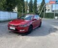 Красный Мицубиси Лансер, объемом двигателя 2 л и пробегом 181 тыс. км за 5499 $, фото 1 на Automoto.ua