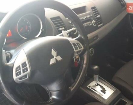 Червоний Міцубісі Lancer, об'ємом двигуна 2 л та пробігом 141 тис. км за 7600 $, фото 13 на Automoto.ua