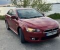 Красный Мицубиси Лансер, объемом двигателя 2 л и пробегом 260 тыс. км за 5600 $, фото 1 на Automoto.ua