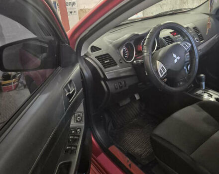 Красный Мицубиси Лансер, объемом двигателя 2 л и пробегом 65 тыс. км за 9300 $, фото 9 на Automoto.ua