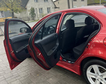 Червоний Міцубісі Lancer, об'ємом двигуна 2 л та пробігом 150 тис. км за 7000 $, фото 11 на Automoto.ua