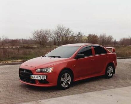 Красный Мицубиси Лансер, объемом двигателя 2 л и пробегом 200 тыс. км за 6000 $, фото 2 на Automoto.ua