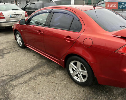 Красный Мицубиси Лансер, объемом двигателя 2 л и пробегом 330 тыс. км за 5250 $, фото 14 на Automoto.ua