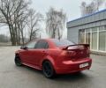 Красный Мицубиси Лансер, объемом двигателя 2 л и пробегом 223 тыс. км за 5800 $, фото 4 на Automoto.ua