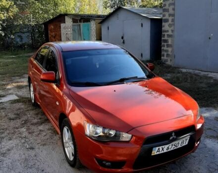 Красный Мицубиси Лансер, объемом двигателя 2 л и пробегом 110 тыс. км за 7500 $, фото 3 на Automoto.ua