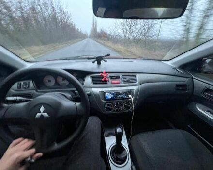 Красный Мицубиси Лансер, объемом двигателя 1.6 л и пробегом 265 тыс. км за 2956 $, фото 12 на Automoto.ua