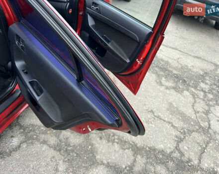 Красный Мицубиси Лансер, объемом двигателя 2 л и пробегом 330 тыс. км за 5250 $, фото 6 на Automoto.ua