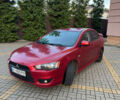 Красный Мицубиси Лансер, объемом двигателя 2 л и пробегом 143 тыс. км за 5200 $, фото 1 на Automoto.ua